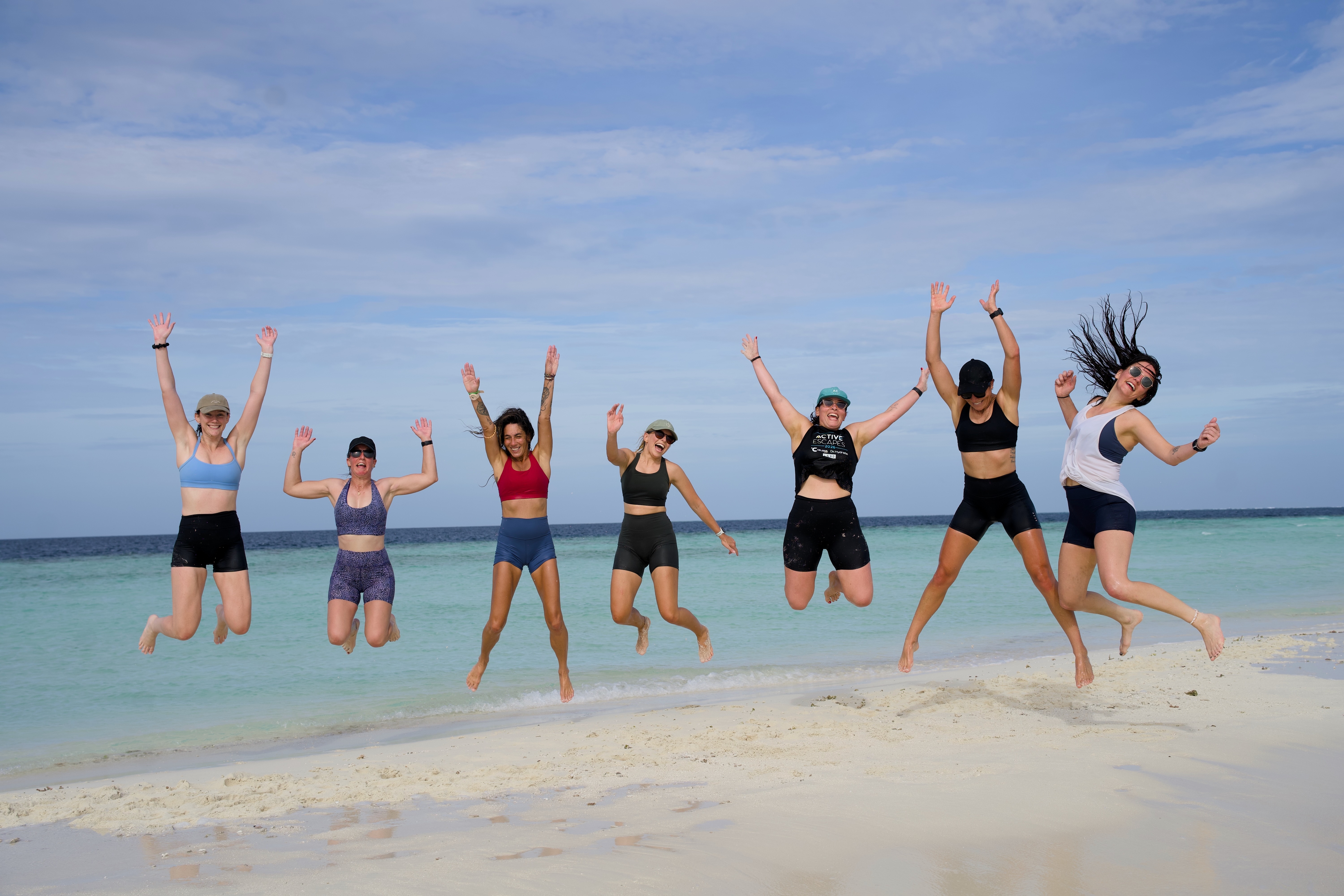 Group jump on the beach, Maldives Boat Escape